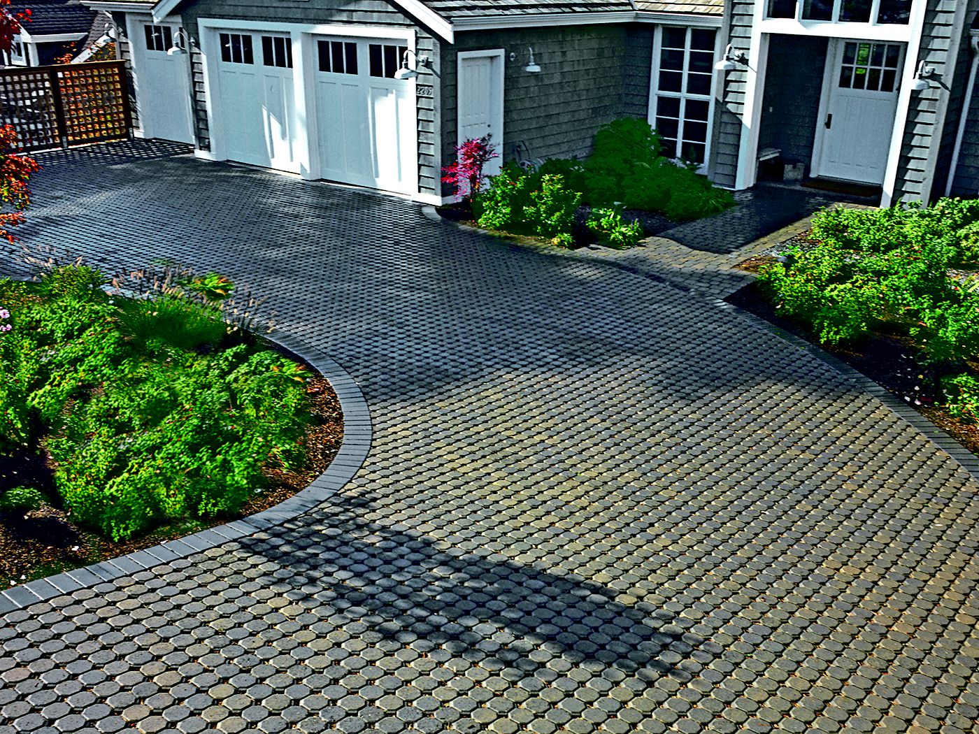 pervious pavers in a driveway in front of a house