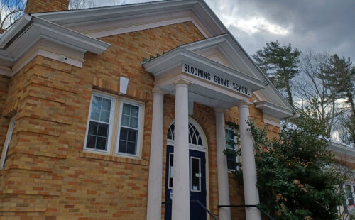 The front of the District's building with a light snow cover