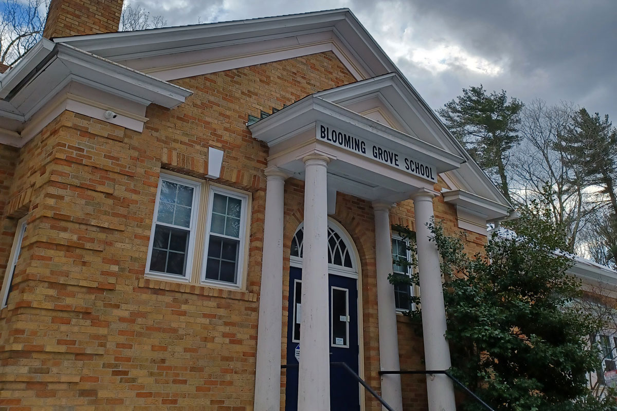 The front of the District's building with a light snow cover