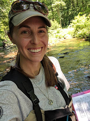 Pike County Conservation District Watershed Specialist Rachel Posavetz collecting field data.
