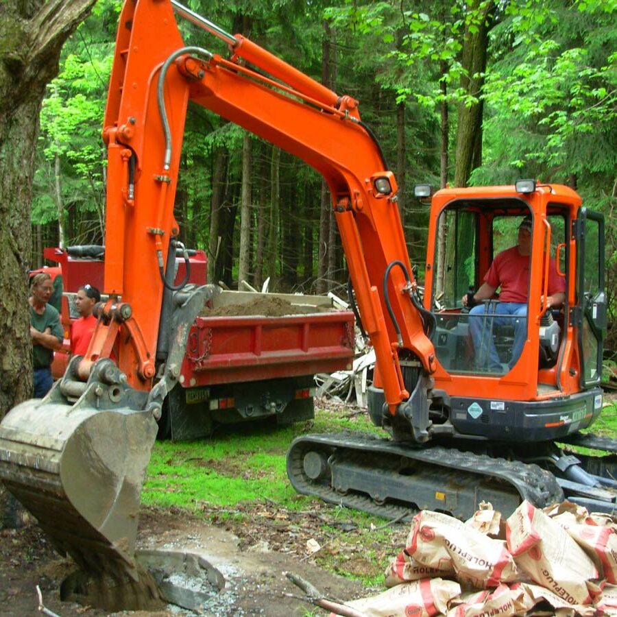 a professional team with an excavator, dump truck and a number of crew to execute the job