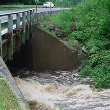 Water rushing under a bridge