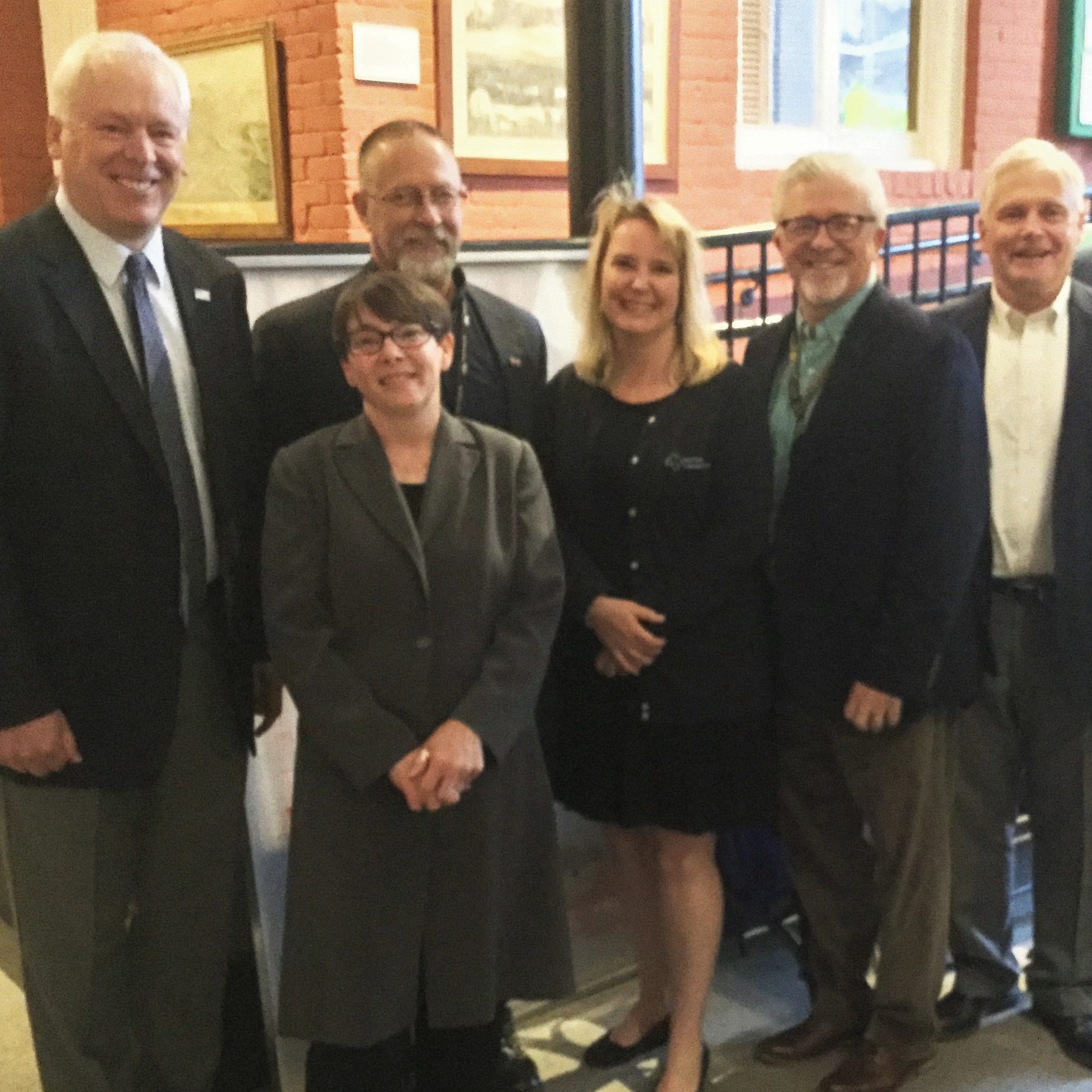 Group photo of commissioners and PCCD executive director